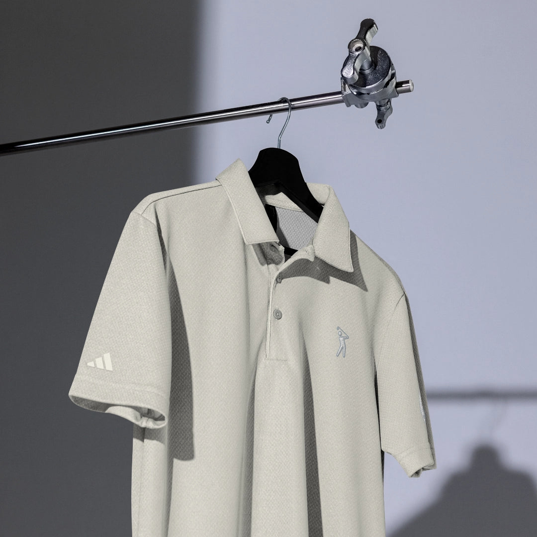 Space-Dyed Polo Shirt from YOLO Golf-adidas X in Heather Gray with modern fit and sleek space-dyed pattern, ideal for golf and athleisure wear.